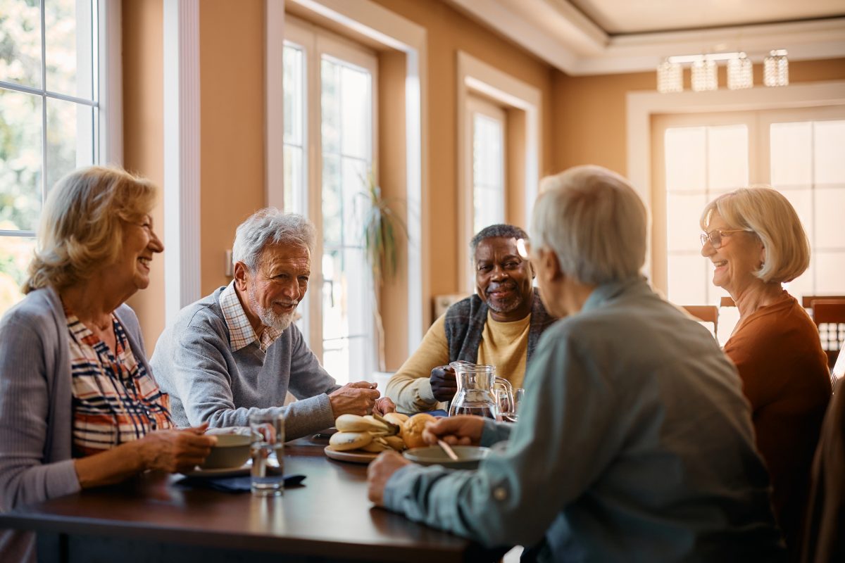 A group of seniors having breakfast together